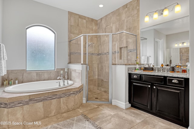 2922 Addison Dr, Melbourne, FL 32940 - bathroom featuring a garden tub, vanity, a stall shower, and tile patterned floors