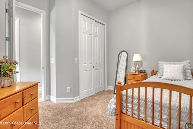 2922 Addison Dr, Melbourne, FL 32940 - bedroom with light colored carpet, baseboards, and a closet