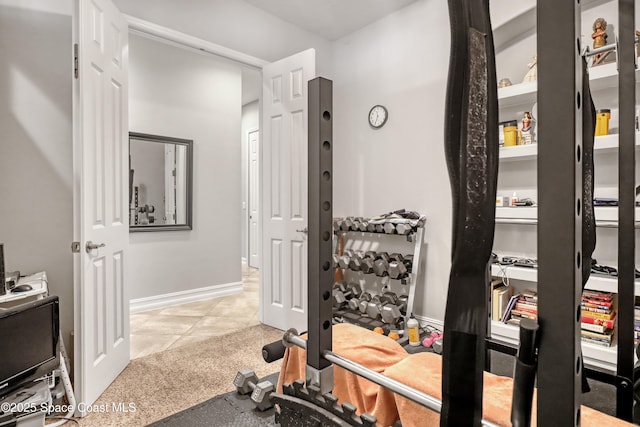 2922 Addison Dr, Melbourne, FL 32940 - workout area with tile patterned flooring, baseboards, and carpet flooring