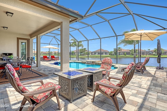 2922 Addison Dr, Melbourne, FL 32940 - view of patio / terrace with a fire pit, an outdoor pool, glass enclosure, and a water view