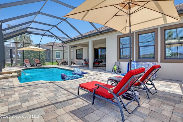 2922 Addison Dr, Melbourne, FL 32940 - swimming pool with a patio area, a hot tub, outdoor dining area, and glass enclosure