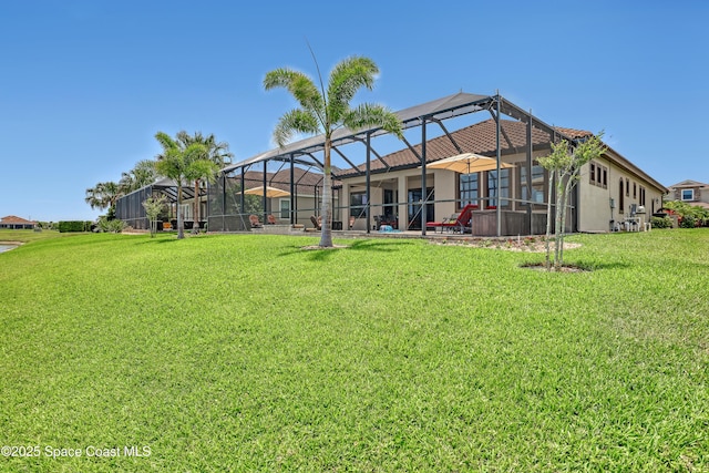 2922 Addison Dr, Melbourne, FL 32940 - back of property featuring a lawn, glass enclosure, and stucco siding
