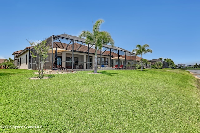 2922 Addison Dr, Melbourne, FL 32940 - rear view of property featuring stucco siding, a yard, and a lanai