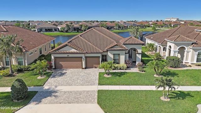 2922 Addison Dr, Melbourne, FL 32940 - mediterranean / spanish house with a residential view, an attached garage, decorative driveway, and stucco siding