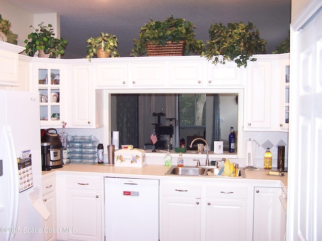 4077 Green Oak Dr, Melbourne, FL 32901 - kitchen with white appliances, a sink, and white cabinets