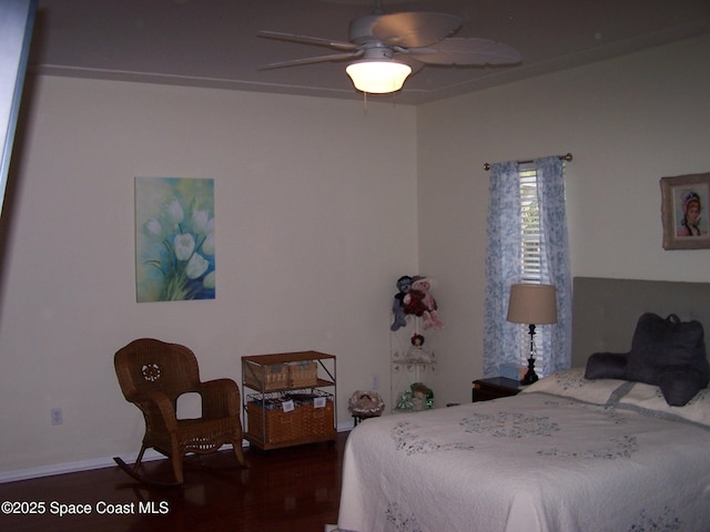 4077 Green Oak Dr, Melbourne, FL 32901 - bedroom with wood finished floors, ceiling fan, and baseboards