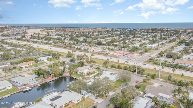 407 Sandpiper Dr, Satellite Beach, FL 32937 - aerial view of property and surrounding area featuring a large body of water and nearby suburban area