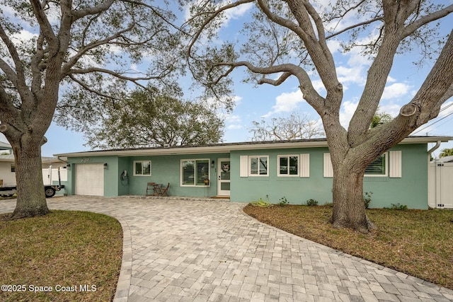 407 Sandpiper Dr, Satellite Beach, FL 32937 - single story home featuring decorative driveway, a garage, and stucco siding