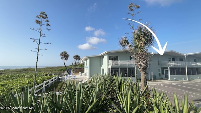 2625 S Atlantic Ave Unit 17, Cocoa Beach, FL 32931 - view of property exterior featuring a balcony and stucco siding