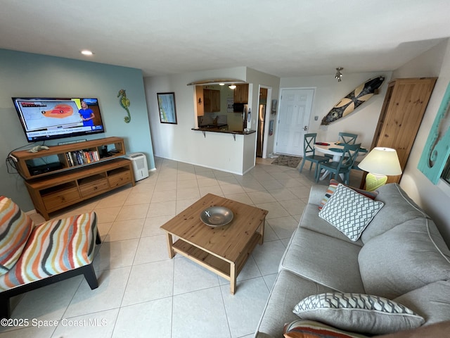 2625 S Atlantic Ave Unit 17, Cocoa Beach, FL 32931 - living area featuring light tile patterned floors and recessed lighting
