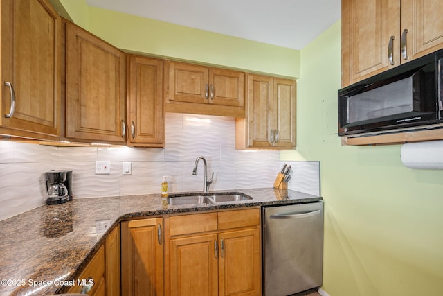 2625 S Atlantic Ave Unit 17, Cocoa Beach, FL 32931 - kitchen featuring black microwave, dishwasher, a sink, backsplash, and brown cabinetry