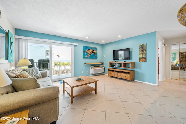 2625 S Atlantic Ave Unit 17, Cocoa Beach, FL 32931 - living area featuring baseboards, tile patterned floors, a textured ceiling, and recessed lighting