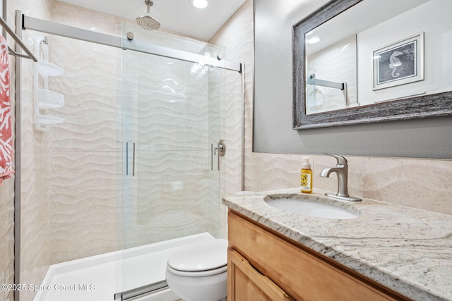 2625 S Atlantic Ave Unit 17, Cocoa Beach, FL 32931 - full bath featuring a shower stall, toilet, vanity, and tasteful backsplash
