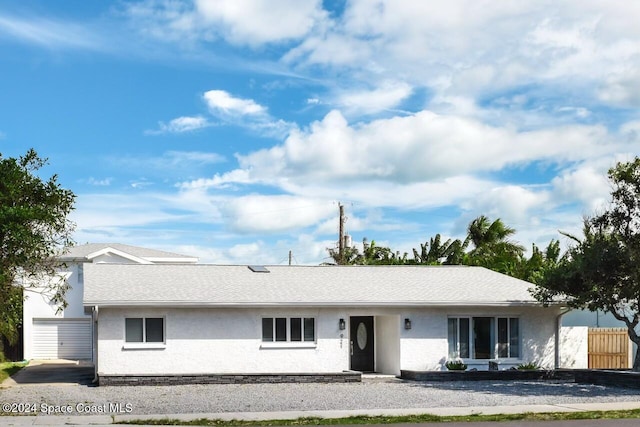 921 S Orlando Ave, Cocoa Beach, FL 32931 - view of front of home featuring stucco siding and roof with shingles