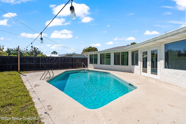 921 S Orlando Ave, Cocoa Beach, FL 32931 - view of pool featuring a patio, a fenced backyard, and french doors