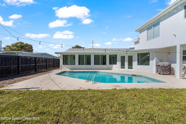 921 S Orlando Ave, Cocoa Beach, FL 32931 - view of swimming pool featuring a patio, french doors, and grilling area