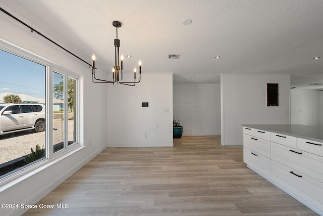921 S Orlando Ave, Cocoa Beach, FL 32931 - unfurnished dining area with a chandelier, baseboards, light wood-style flooring, and recessed lighting