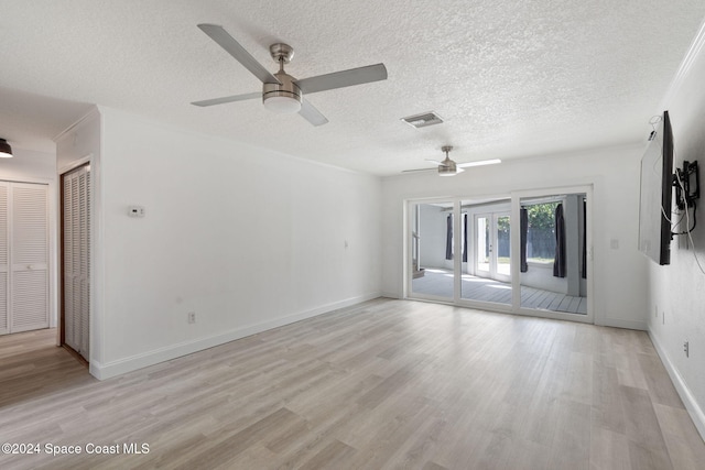 921 S Orlando Ave, Cocoa Beach, FL 32931 - spare room with a ceiling fan, light wood-type flooring, a textured ceiling, and baseboards