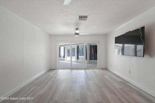 921 S Orlando Ave, Cocoa Beach, FL 32931 - empty room with ceiling fan, wood finished floors, a textured ceiling, baseboards, and crown molding