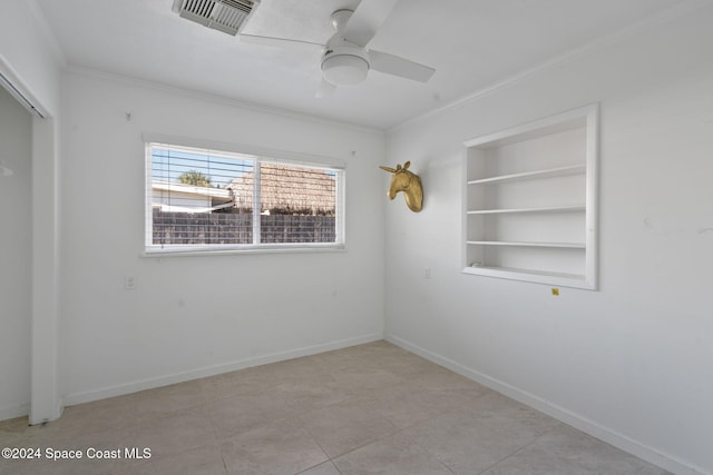 921 S Orlando Ave, Cocoa Beach, FL 32931 - unfurnished room with crown molding, a ceiling fan, built in features, and baseboards