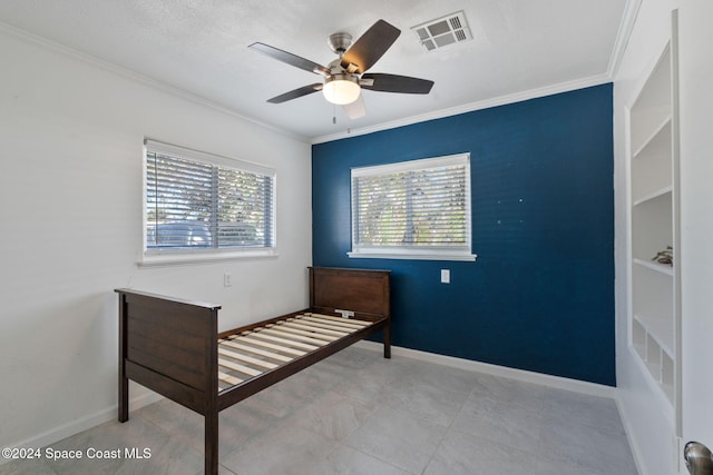 921 S Orlando Ave, Cocoa Beach, FL 32931 - bedroom with crown molding, ceiling fan, and baseboards