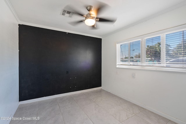 921 S Orlando Ave, Cocoa Beach, FL 32931 - spare room featuring ceiling fan, crown molding, and baseboards