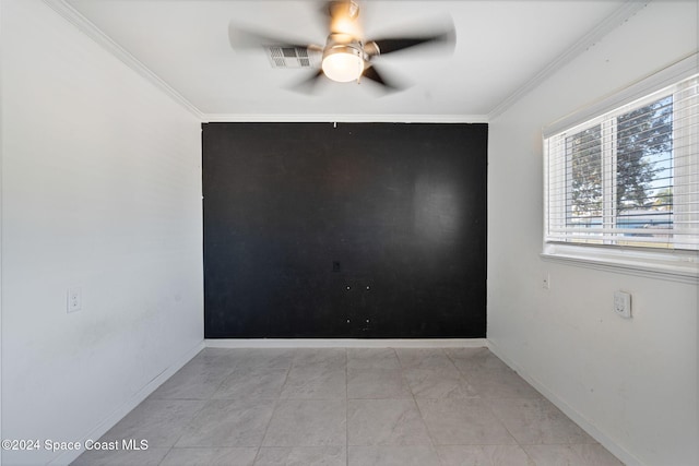 921 S Orlando Ave, Cocoa Beach, FL 32931 - spare room with a ceiling fan, ornamental molding, and baseboards