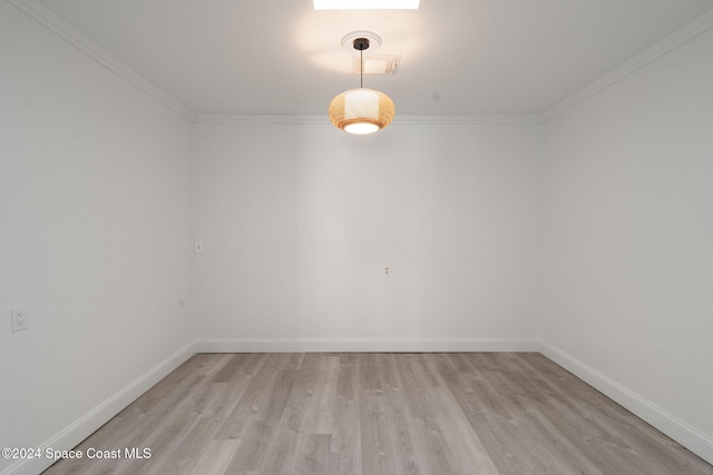 921 S Orlando Ave, Cocoa Beach, FL 32931 - unfurnished room with light wood-style flooring, crown molding, and baseboards