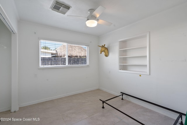 921 S Orlando Ave, Cocoa Beach, FL 32931 - unfurnished bedroom with ornamental molding, a ceiling fan, tile patterned flooring, baseboards, and a closet