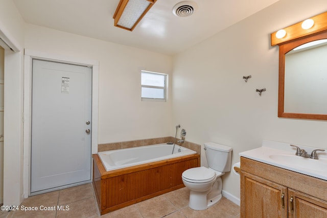 921 S Orlando Ave, Cocoa Beach, FL 32931 - bathroom featuring tile patterned floors, toilet, a bath, vanity, and baseboards