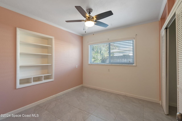 921 S Orlando Ave, Cocoa Beach, FL 32931 - unfurnished bedroom with a closet, crown molding, baseboards, light tile patterned flooring, and ceiling fan