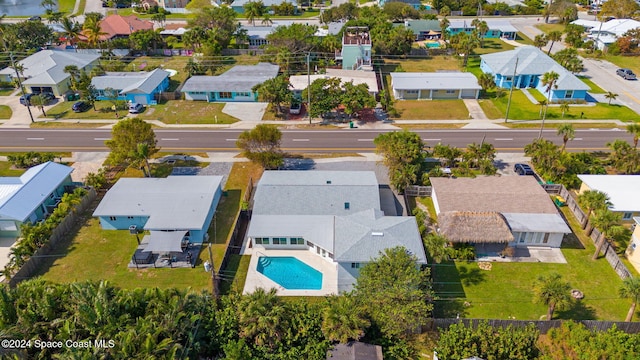 921 S Orlando Ave, Cocoa Beach, FL 32931 - aerial perspective of suburban area featuring a pool area
