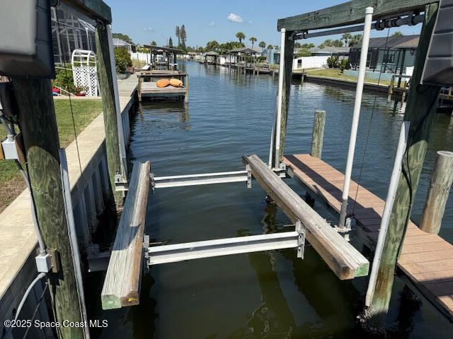1700 Neptune Dr, Merritt Island, FL 32952 - dock area with a water view and boat lift