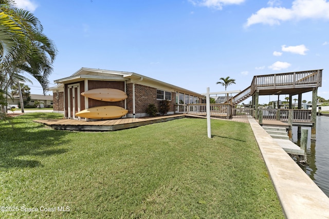 1700 Neptune Dr, Merritt Island, FL 32952 - surrounding community with a wooden deck and a lawn