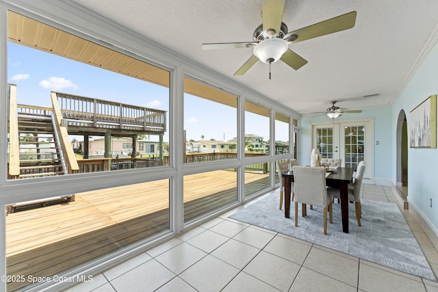 1700 Neptune Dr, Merritt Island, FL 32952 - sunroom / solarium featuring ceiling fan, arched walkways, and outdoor dining space