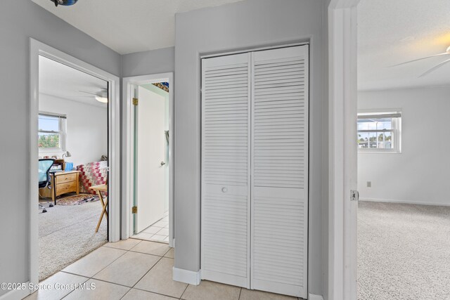 1700 Neptune Dr, Merritt Island, FL 32952 - corridor with plenty of natural light and baseboards