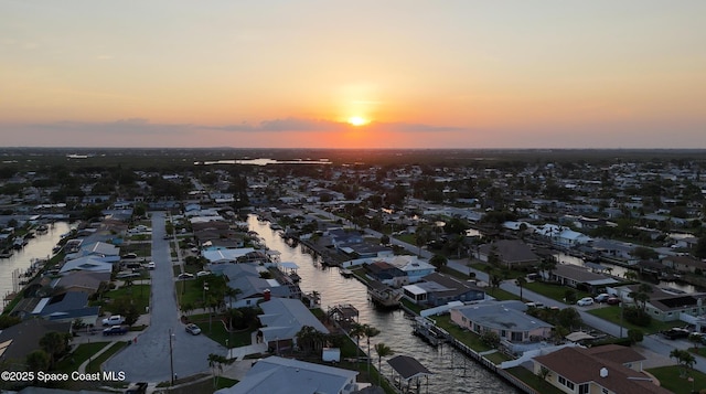 1700 Neptune Dr, Merritt Island, FL 32952 - aerial view at dusk of a water view and a residential view