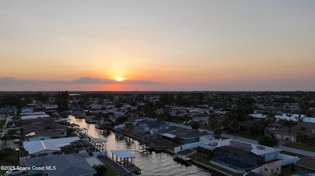1700 Neptune Dr, Merritt Island, FL 32952 - aerial view at dusk of a water view and a residential view