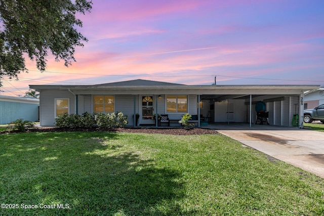 365 Belair Ave, Merritt Island, FL 32953 - ranch-style home with a front yard, driveway, and a carport