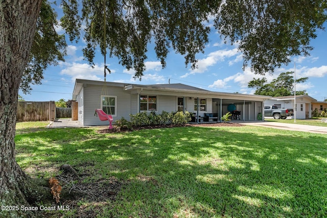 365 Belair Ave, Merritt Island, FL 32953 - single story home with concrete driveway and an attached carport