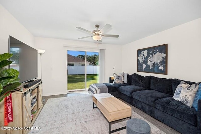 966 Stage St SE, Palm Bay, FL 32909 - living area featuring wood finished floors, ceiling fan, and baseboards