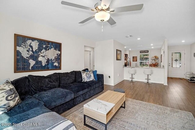 966 Stage St SE, Palm Bay, FL 32909 - living area featuring wood finished floors, a ceiling fan, and recessed lighting