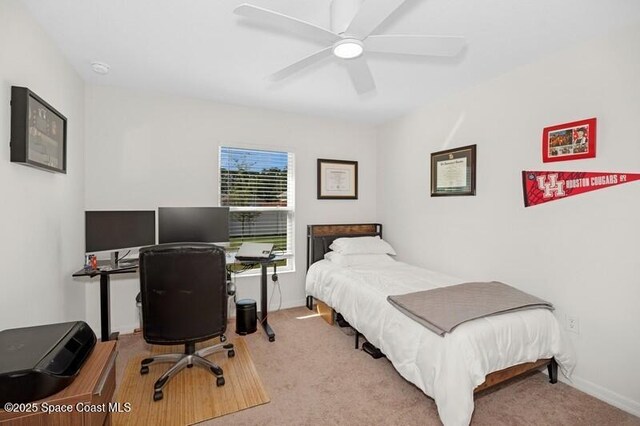 966 Stage St SE, Palm Bay, FL 32909 - bedroom with carpet flooring, a desk, baseboards, and a ceiling fan
