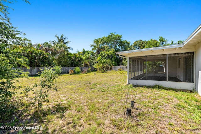 view of yard featuring a sunroom