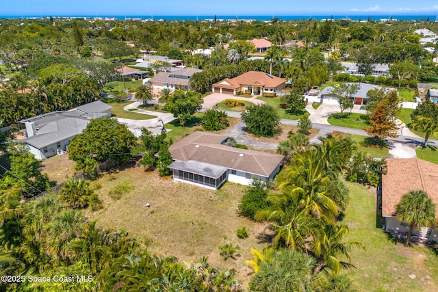 aerial perspective of suburban area featuring a nearby body of water