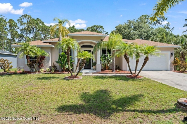 471 Hallmark St SE, Palm Bay, FL 32909 - mediterranean / spanish-style home with stucco siding, driveway, a garage, and a front lawn