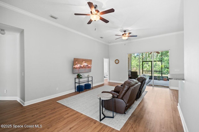 471 Hallmark St SE, Palm Bay, FL 32909 - living room with ceiling fan, wood finished floors, baseboards, and ornamental molding