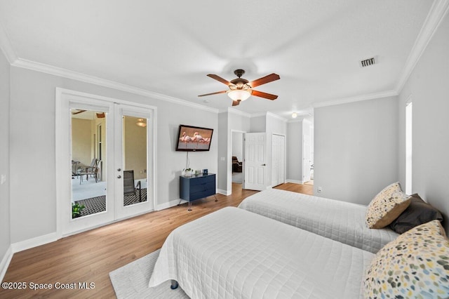 471 Hallmark St SE, Palm Bay, FL 32909 - bedroom with wood finished floors, ornamental molding, baseboards, access to exterior, and ceiling fan