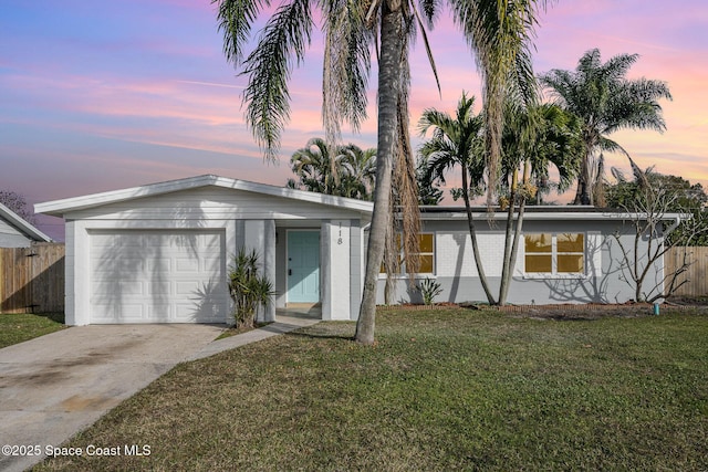 118 1st St, Merritt Island, FL 32953 - view of front of house with driveway and an attached garage