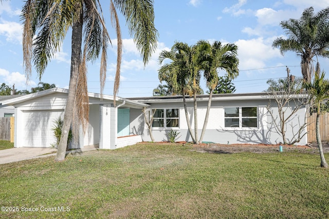 118 1st St, Merritt Island, FL 32953 - mid-century modern home with an attached garage, concrete driveway, and concrete block siding